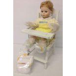 A Danbury Mint doll 'Sitting Pretty' complete in white wooden high chair. In original box with