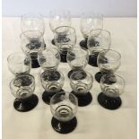 15 graduated glasses c.1930's with etched decoration and black stems.