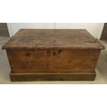 Antique pine trunk with metal handles. 78 x 51cm.