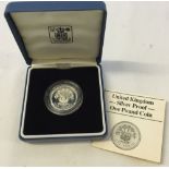 A 1986 silver proof one pound coin in presentation case.