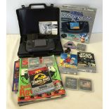 A boxed Sega Game Gear (not working) together with power adapter, carrying case, a collection of