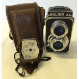 A Halina AI camera, in case with light meter.