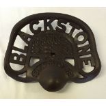 A cast iron reproduction Blackstone tractor seat.