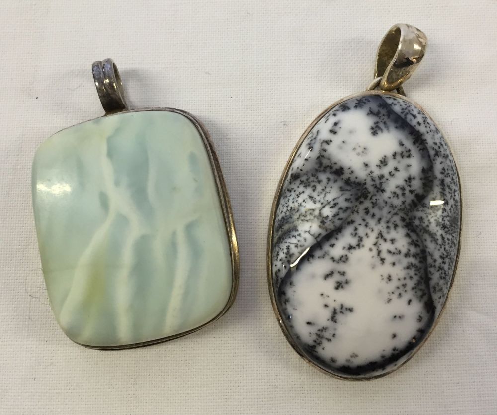 2 silver and polished stone pendants