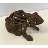 A vintage cast iron frog.