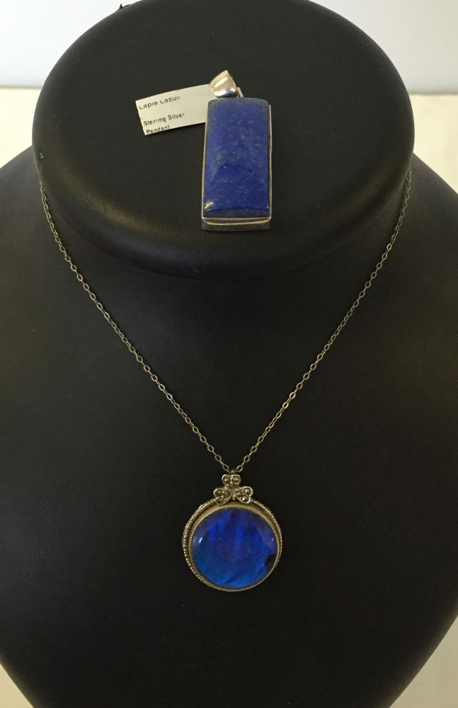 A Lapis Lazuli & sterling silver pendant with a white metal & blue glass pendant & chain.