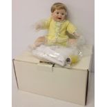 A Danbury mint doll 'Playing Footsie'. In original box with certificate. As new 12 inches tall.