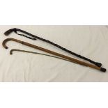 3 walking sticks, one made from rosewood.