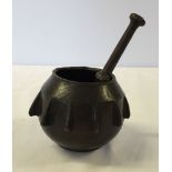 A bronze pestle & mortar.