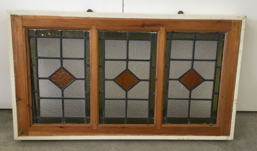 3 vintage lead light windows framed together.
