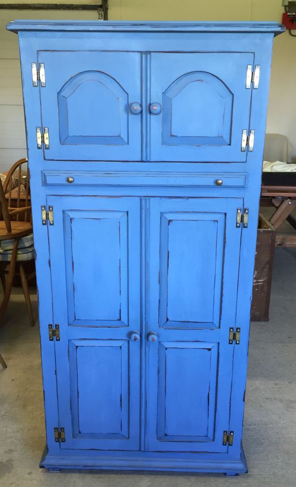 A blue painted pine drinks cabinet with wine rack below and pull-out shelf. 155cm tall, 76cm