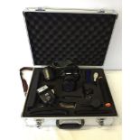 An Olympus E410 10 megapixel camera with zoom lense, full accessories and metal carry case.