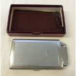 A boxed Mosda Streamline combined lighter and cigarette case.