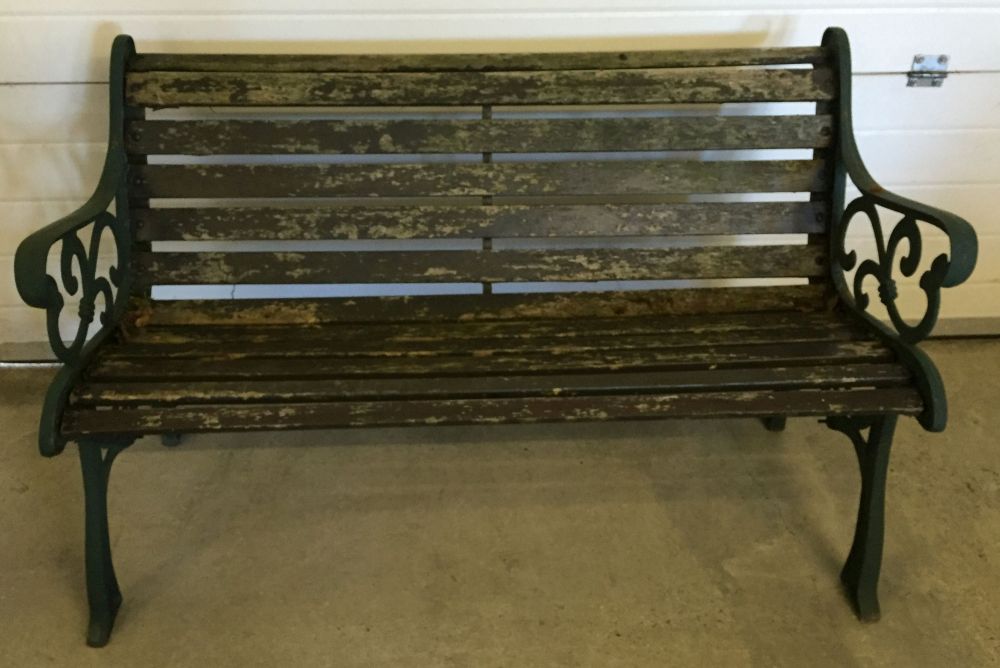 A garden bench with cast iron ends.