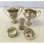 5 HM silver items to include 2 silver trophies, 2 napkin rings and a pepperette. Total weight approx