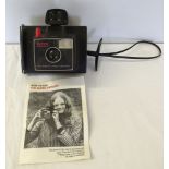 A vintage Polaroid Super Swinger camera.