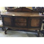 An oak buffet sideboard with carved decoration approx 5' (152cm) long.