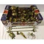 A box of brassware to include candlesticks and animals.