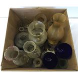 A box of oil lamps and shades.