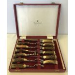 A cased set of horn handled steak knives & forks by Harrison Bros & Houson Ltd.