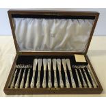 A cased set of silver handled fish knives & forks by Reid & Sons. In wooden case with key.