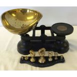 A set of Salter kitchen scales with brass weights.