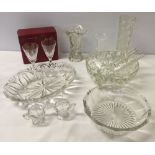 A collection of glass items to include a pair of salts with spoons.