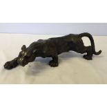 A cast iron reproduction lion figure.