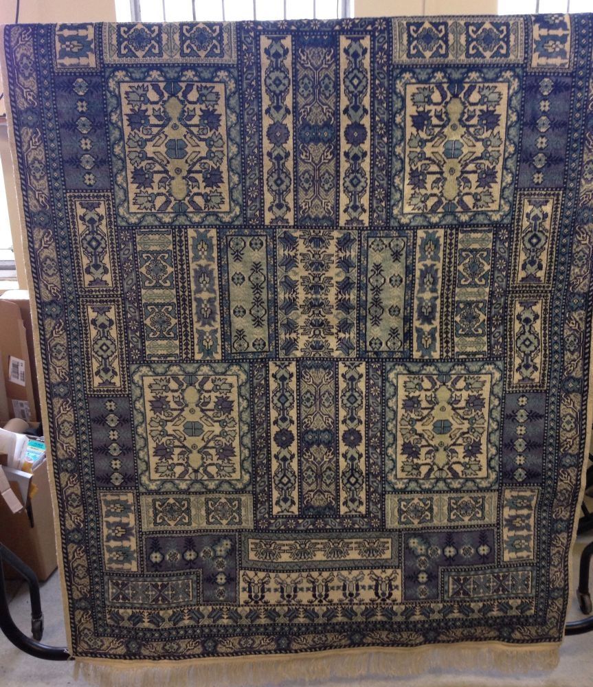 A modern Tunisian blue and white patterned silk rug. Approx 6ft x 4ft in excellent condition.