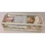 A Danbury Mint doll 'Sweet Dreams' complete in white wooden cradle. In original box with