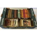 A box of books to include 7 Andrew Lang's Fairy books and Western Thriller paperbacks.