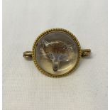 Antique crystal brooch with a hand-painted foxes head on the reverse. The miniature is set in a gold