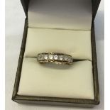 9ct gold full eternity ring set with white stones. Size N, weight approx 3.2g.