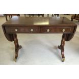 A Victorian walnut sofa table. 51 x 180cm when end leaves open.