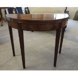 An Edwardian mahogany breakfast table with inlaid legs. 90cm diameter when opened.