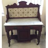 A Victorian/early 20th century tiled back mahogany wash stand with marble top. 98cm wide