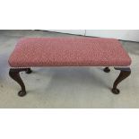 A Victorian 2 seater stool in red upholstery. Seat 90cm wide