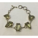 Heavy hallmarked silver bracelet set with large citrine stones. Has T bar fastening. As new in