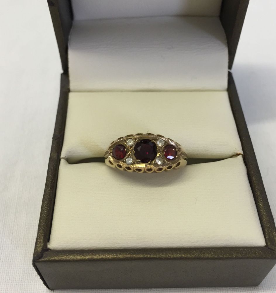 9ct gold ladies ring in a Victorian style set with 3 garnets and diamonds. Size L, weight approx 1.