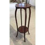 A Victorian mahogany plant stand.