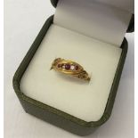 Antique 18ct dress ring set with 3 rubies & 2 diamonds - one diamond needs resetting. Hallmark