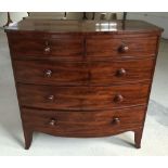 A Victorian bow fronted mahogany 2 over 3 chest of drawers. 105cm wide and 105cm tall