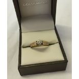 9ct gold solitaire diamond ring. Stone size approx 0.04ct, weight approx 2.6g.