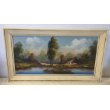 Framed oil on canvas of a lake & woodland scene with cottage. 38 x 78cm