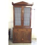 An early 19th century flame mahogany bookcase with wire grill doors. 112cm wide and 238cm tall