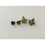 A pair of 9ct gold maple leaf design earrings with 9ct gold backs, together with gold clover