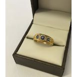 Antique 18ct gold ring set with 3 sapphires and 4 diamonds, size P, weight approx 3.4g.