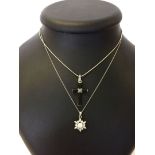 2 silver pendants on chains. One is a cross with black onyx and marcasite decoration - and the other