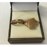 A 9ct gold signet ring (approx 2.7g) size U½ with a 22ct gold wedding band (approx 1.7g). Size O.