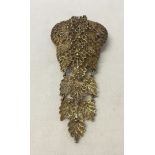 A vintage white metal filigree brooch, possibly continental silver. 8.5cm long.